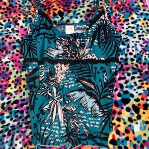 Green top with leaves and nature print.